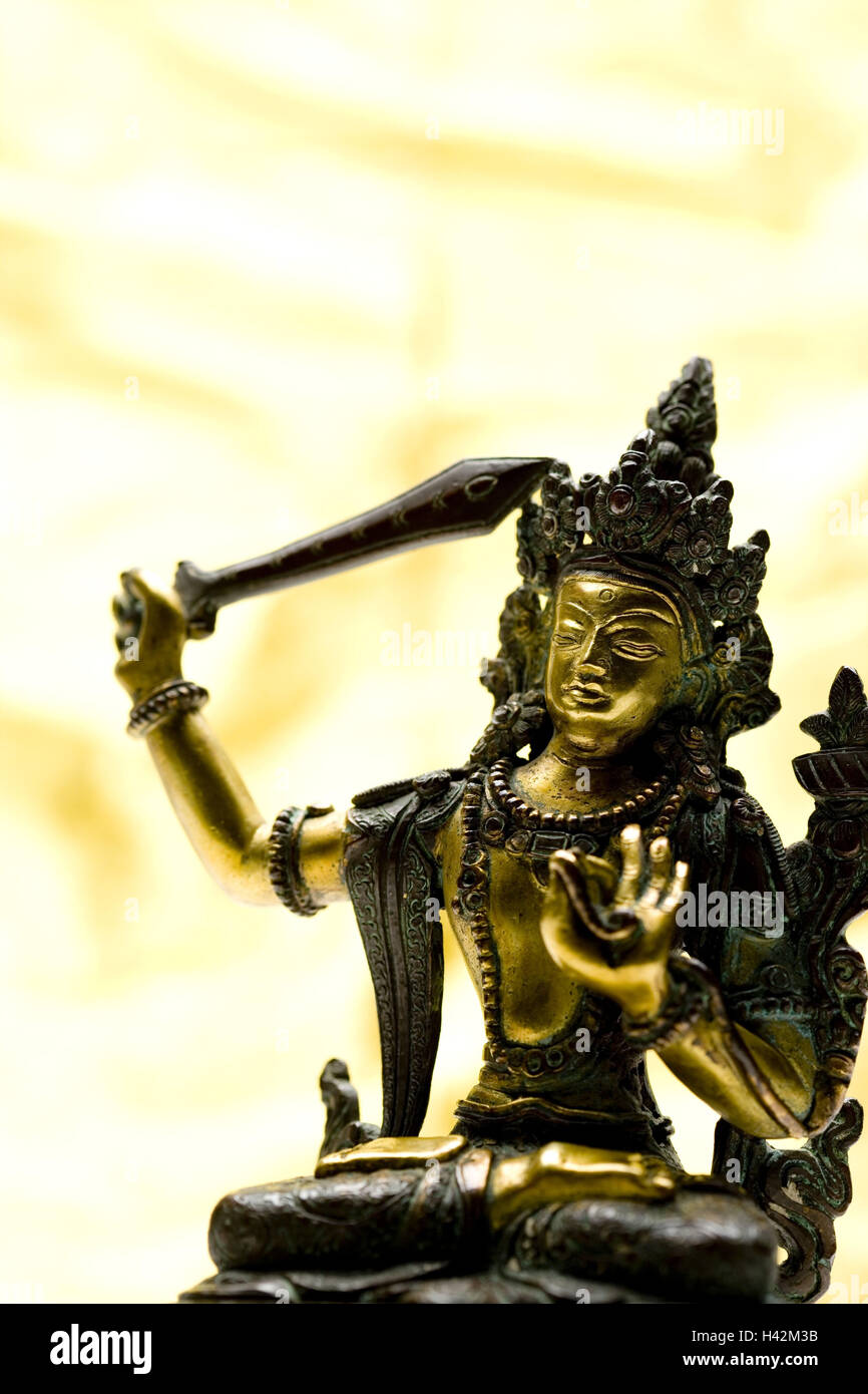 Di colore oro figurina di dio indù Foto Stock