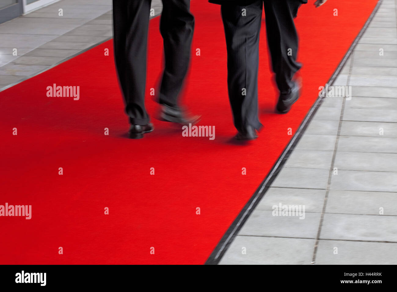La gente di affari su un tappeto rosso, dettaglio Foto Stock
