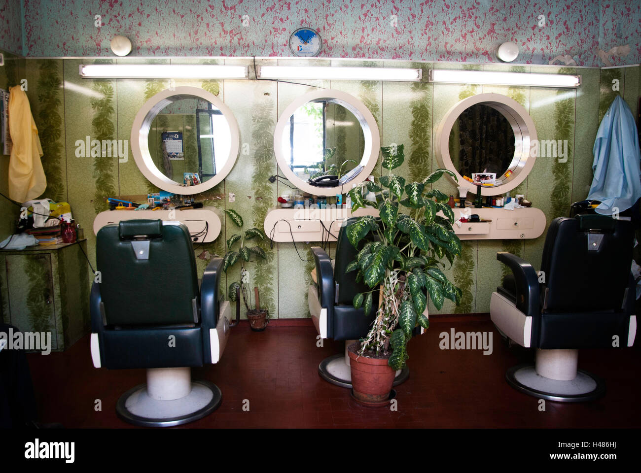 Vecchio barbiere con un design vintage e colori verdi Foto Stock