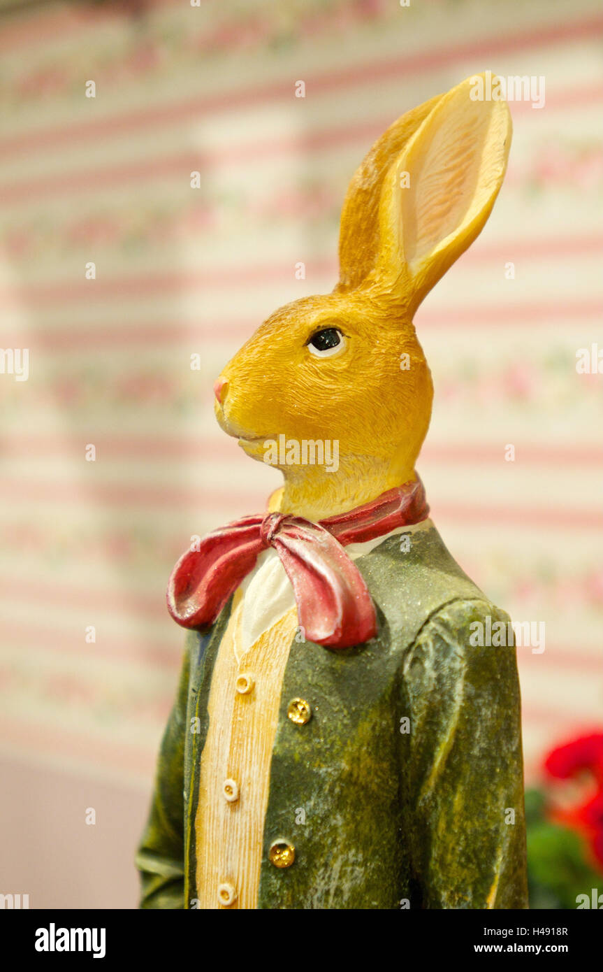 Coniglietto di pasqua con code e inchinarsi di fronte a carta da parati Foto Stock