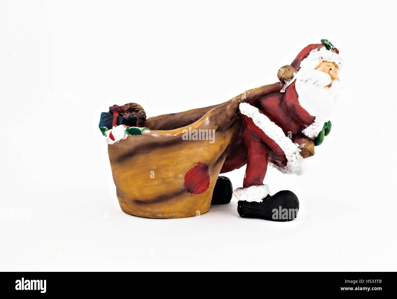 Statuetta di ceramica di Babbo Natale con una grande sacca isolata. Foto Stock