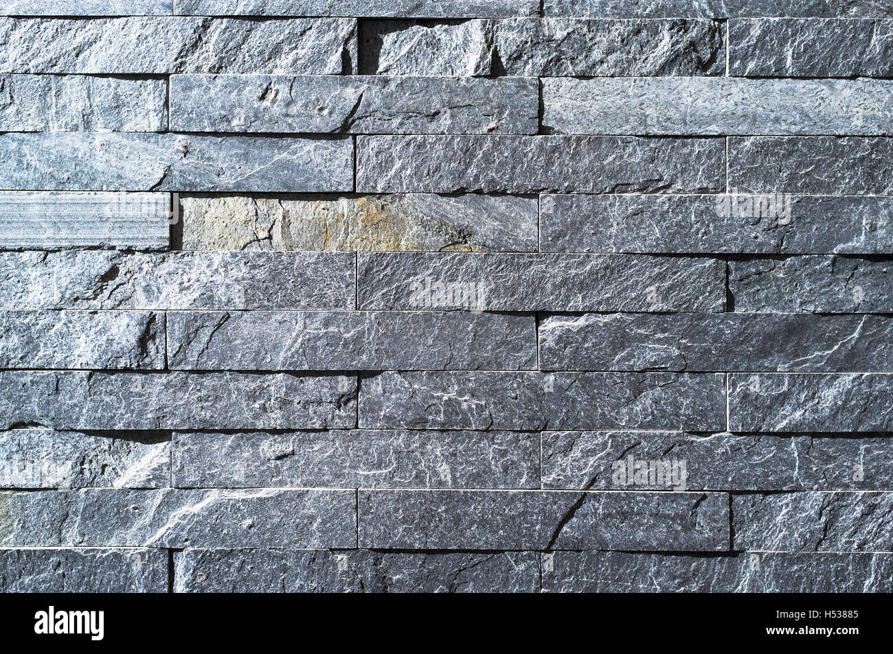 Dh muro di mattoni di pietra grigia di tessitura tessitura della pietra sfondo grigio close up Foto Stock
