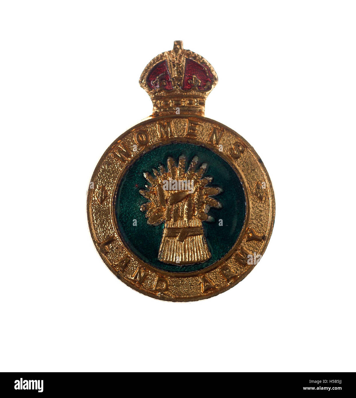 Il distintivo WLA (Women's Land Army) del 1940 simboleggia gli sforzi delle donne che lavoravano nelle fattorie durante la seconda guerra mondiale in Gran Bretagna. La WLA giocò un ruolo cruciale nella produzione alimentare durante la guerra, con le donne che intervennero per colmare la carenza di manodopera agricola causata dalla guerra. Foto Stock