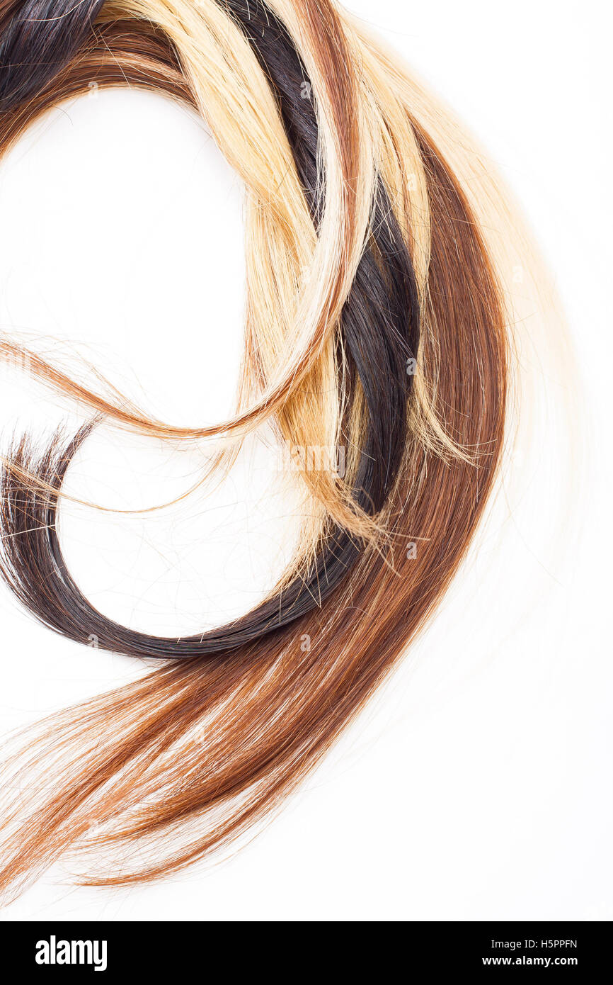 Blonde rosso e nero donne veri capelli umani trama estensione close up foto. Veri europei lungo sano sentire. Foto Stock