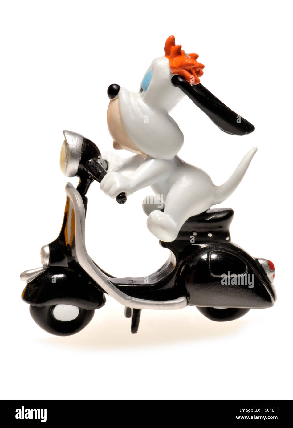 Personaggio dei fumetti - figurine di droopy (MGM) a cavallo di un scooter Foto Stock