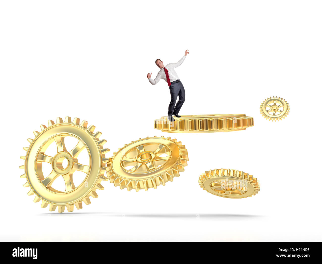 Imprenditore equilibrio stesso su oro parte di ingranaggio Foto Stock