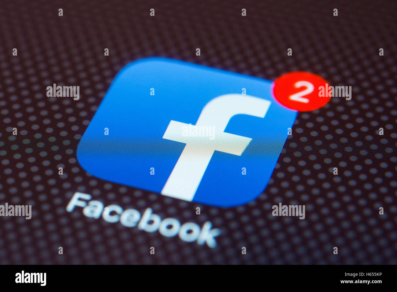 Il social network Facebook app close up su iPhone smart schermata telefono Foto Stock