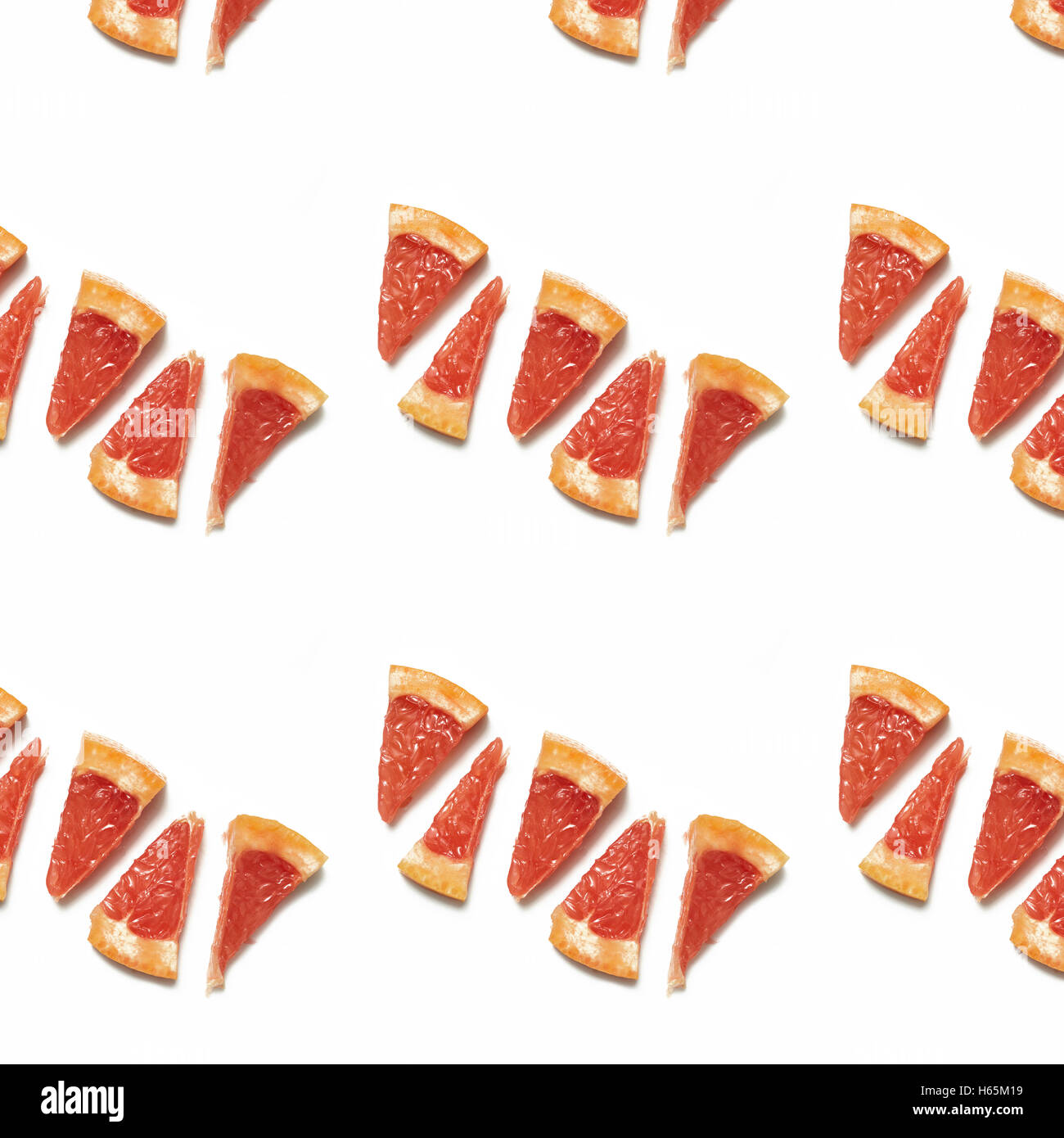 Seamless pattern alimentare: colorful succose fette di pompelmo isolati su sfondo bianco. Agrumi in background. Foto Stock