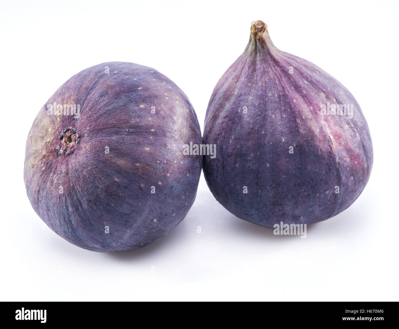 Due maturi frutti figura sullo sfondo bianco. Foto Stock