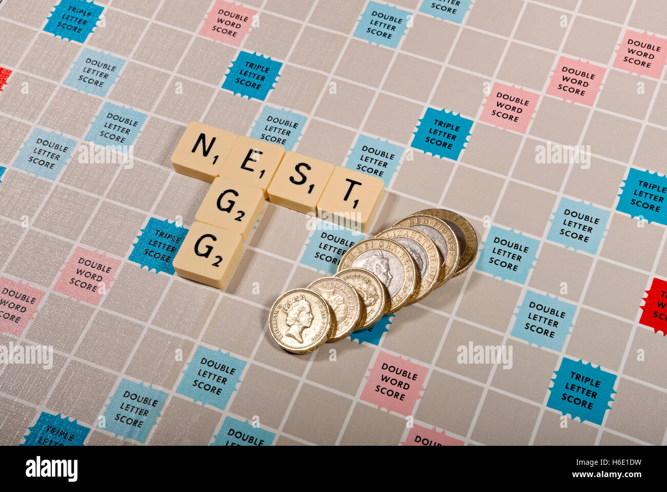 Scrabble board and tiles personal finance business money saving Savings Concept England UK United Kingdom GB Gran Bretagna Foto Stock