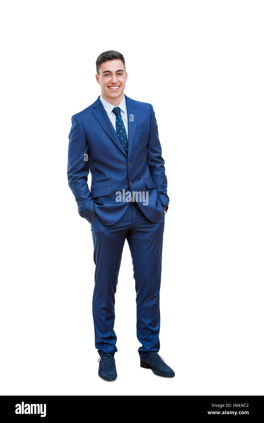 A piena lunghezza ritratto del bel giovane imprenditore in piedi in tuta blu. Isolato su sfondo bianco. Foto Stock