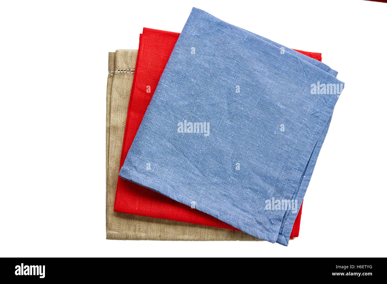 Tre tessuto colorato di tovaglioli, blu, rosso e beige e bianco delle nazioni unite Foto Stock