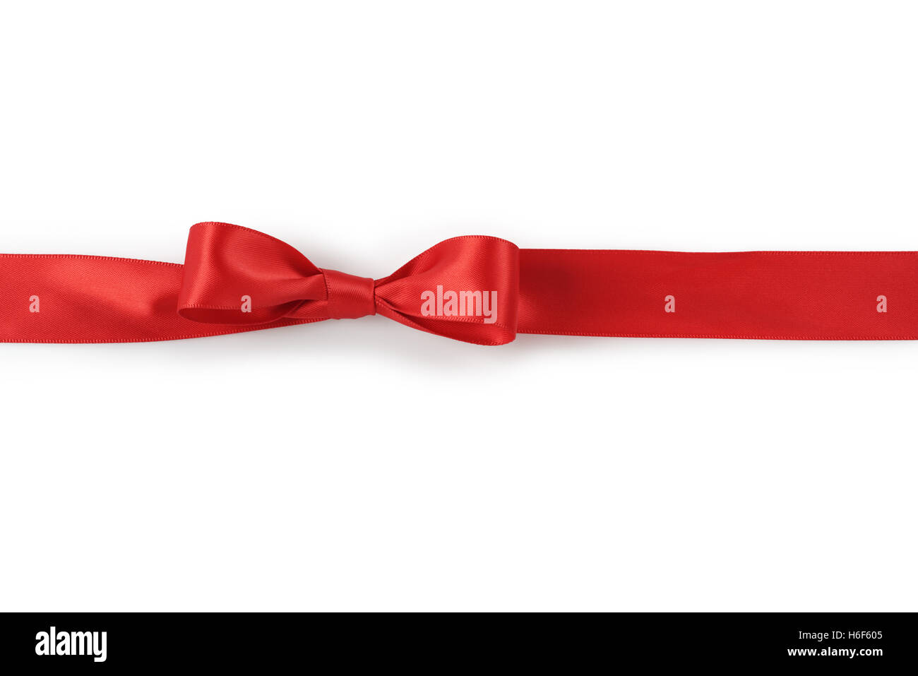 Red Ribbon bow su sfondo bianco con luce ombra Foto Stock