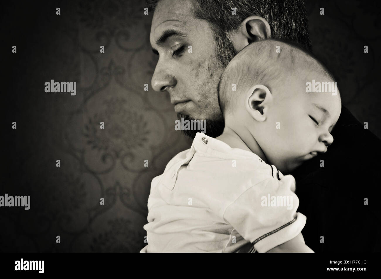 Padre tenendo il suo bambino figlio Foto Stock