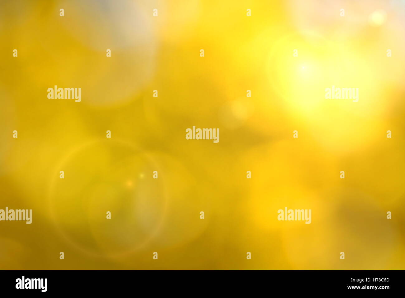 Giallo sfondo bokeh di fondo con lente effetto flare Foto Stock