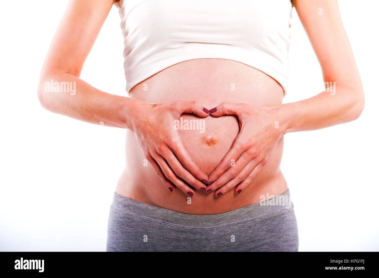 Incantevole bambino. Bambina con un diadema sul suo stomaco e aspira le  dita Foto stock - Alamy