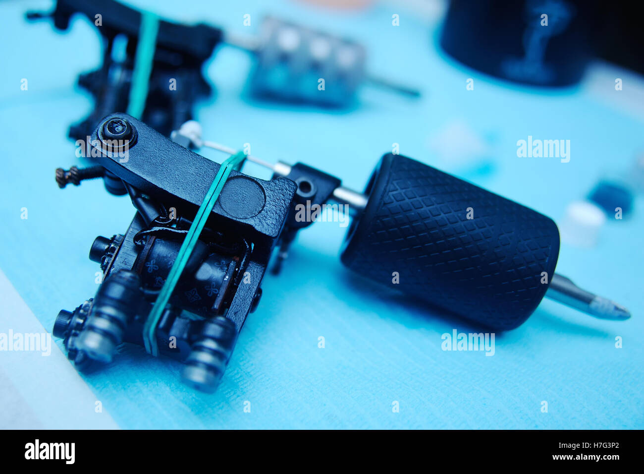 Tattoo Machine sullo sfondo di un studio Foto Stock