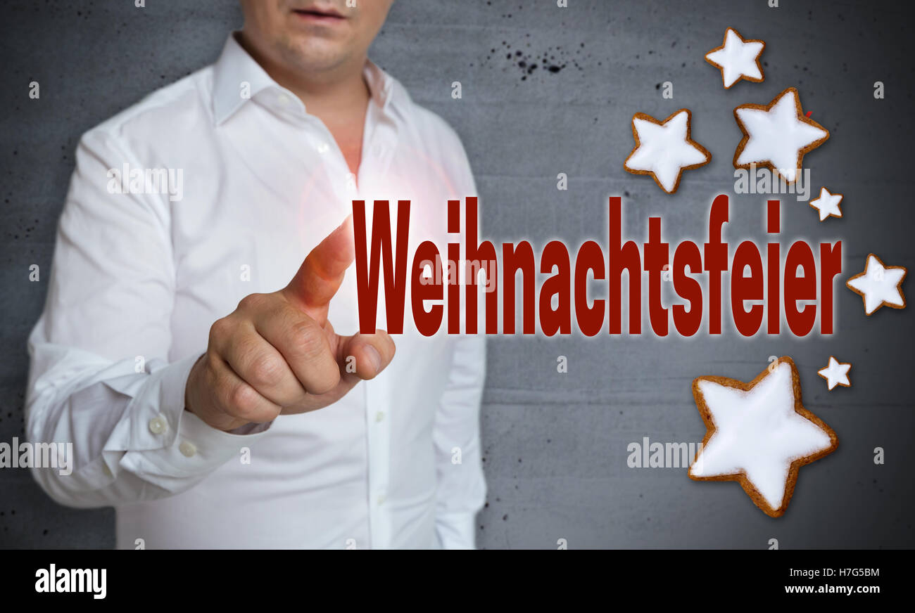 Weihnachtsfeier (in tedesco Christmas Party) touchscreen è azionato dall'uomo. Foto Stock