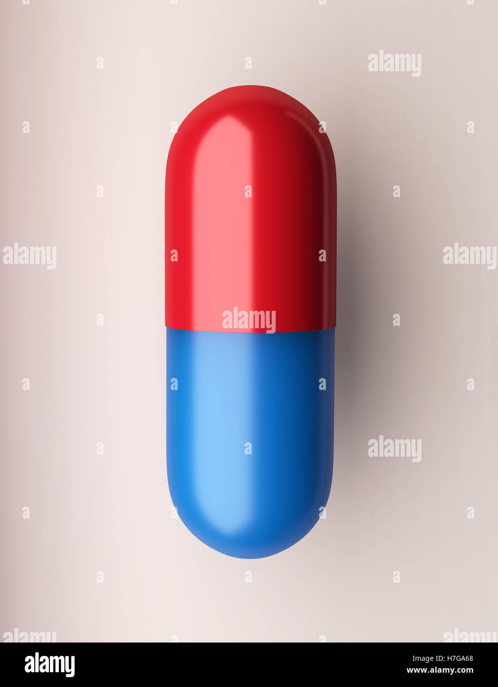 Un blu e pillola rossa su uno sfondo bianco Foto Stock