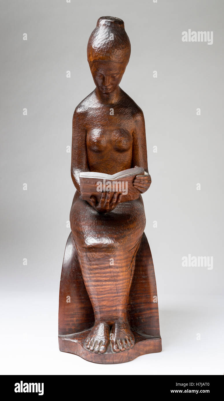 Il lettore, legno di mogano scultura di scultore francese Jean Henninger Foto Stock