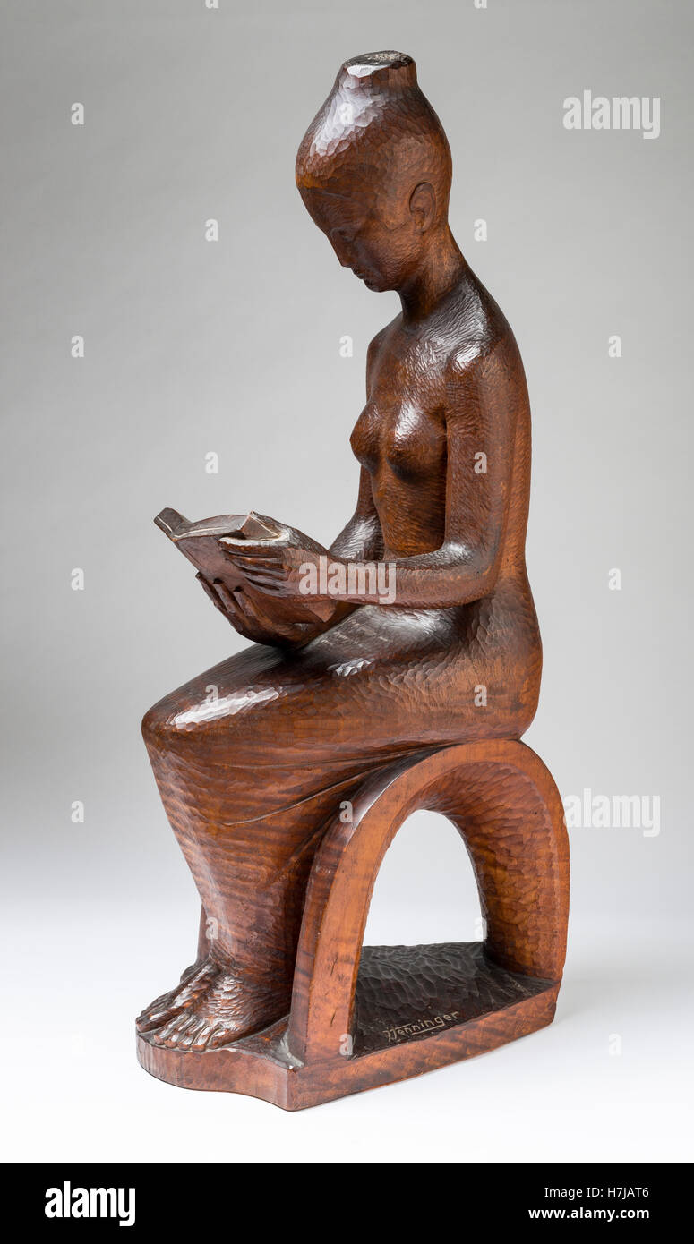 Il lettore, legno di mogano scultura di scultore francese Jean Henninger Foto Stock