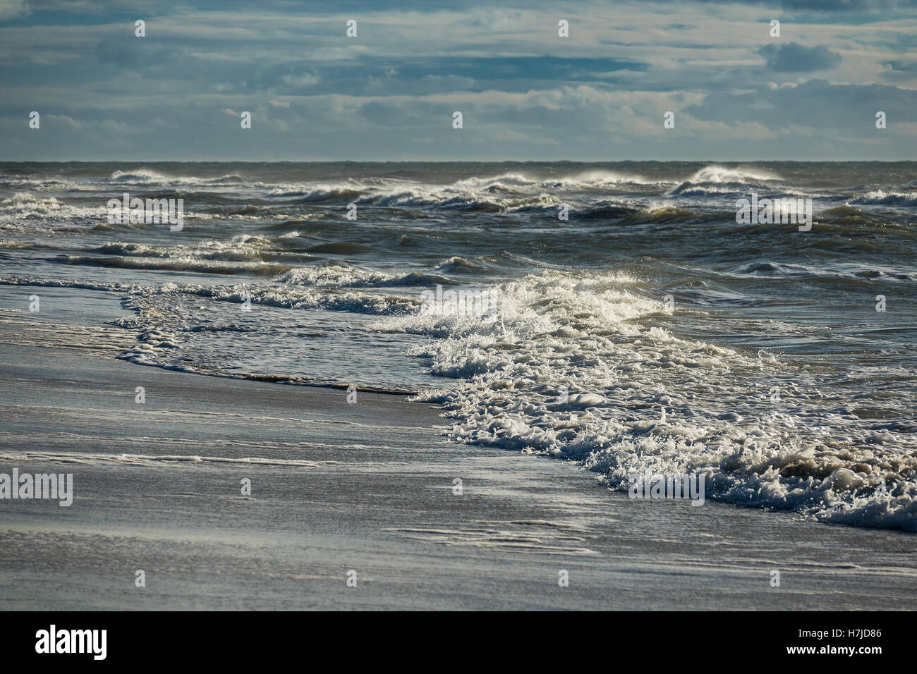 Onde sulla costa del Mare del Nord dell'isola Amrum, Germania Foto Stock