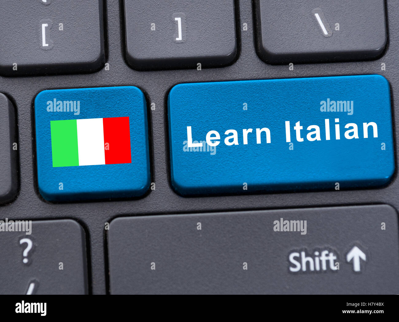 Pulsante con bandiera di Italia e chiave con imparare italiano il testo come l'e-learning concept Foto Stock