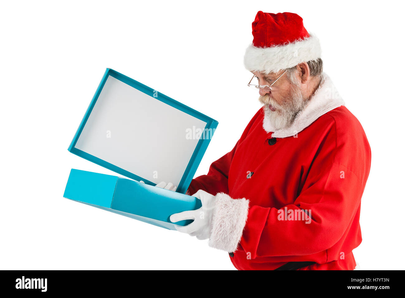 Santa Claus apertura di una confezione regalo Foto Stock