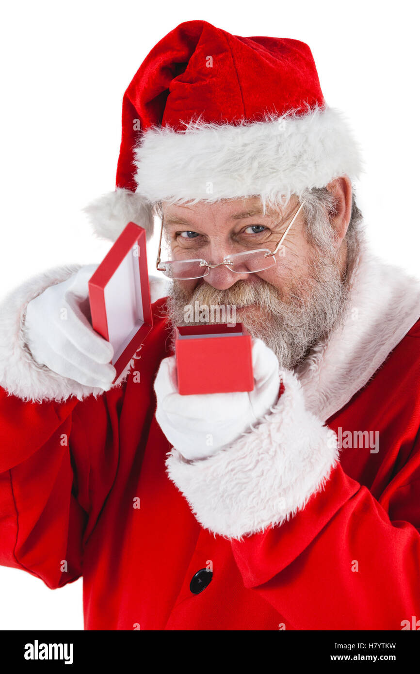 Santa Claus apertura di una confezione regalo Foto Stock