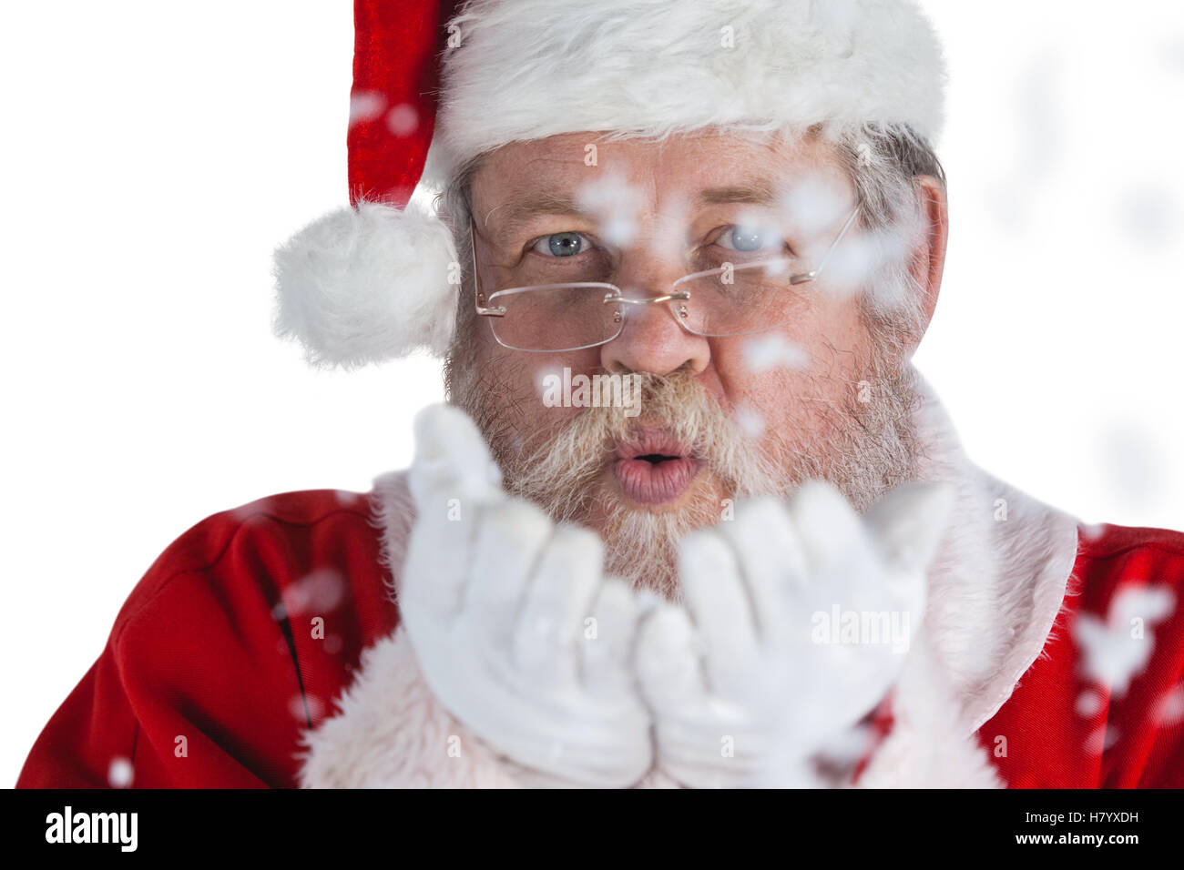 Santa Claus soffiando la neve falsa Foto Stock