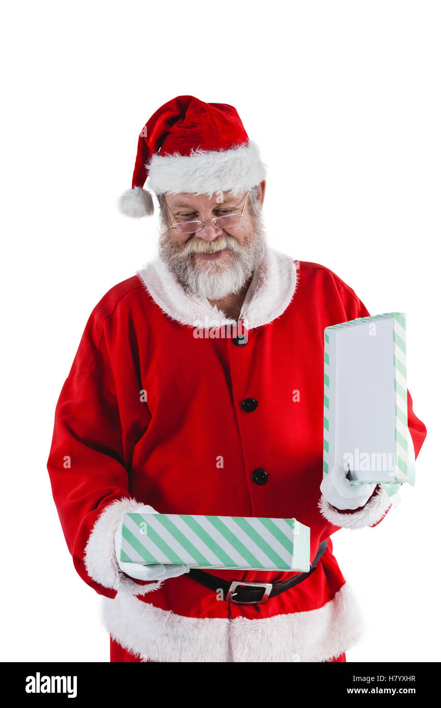 Santa Claus apertura di una confezione regalo Foto Stock