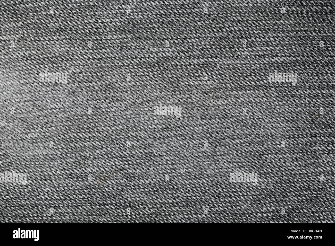 Modello di tessuto texture di denim o blue jeans neri per la progettazione di sfondo astratto. Foto Stock