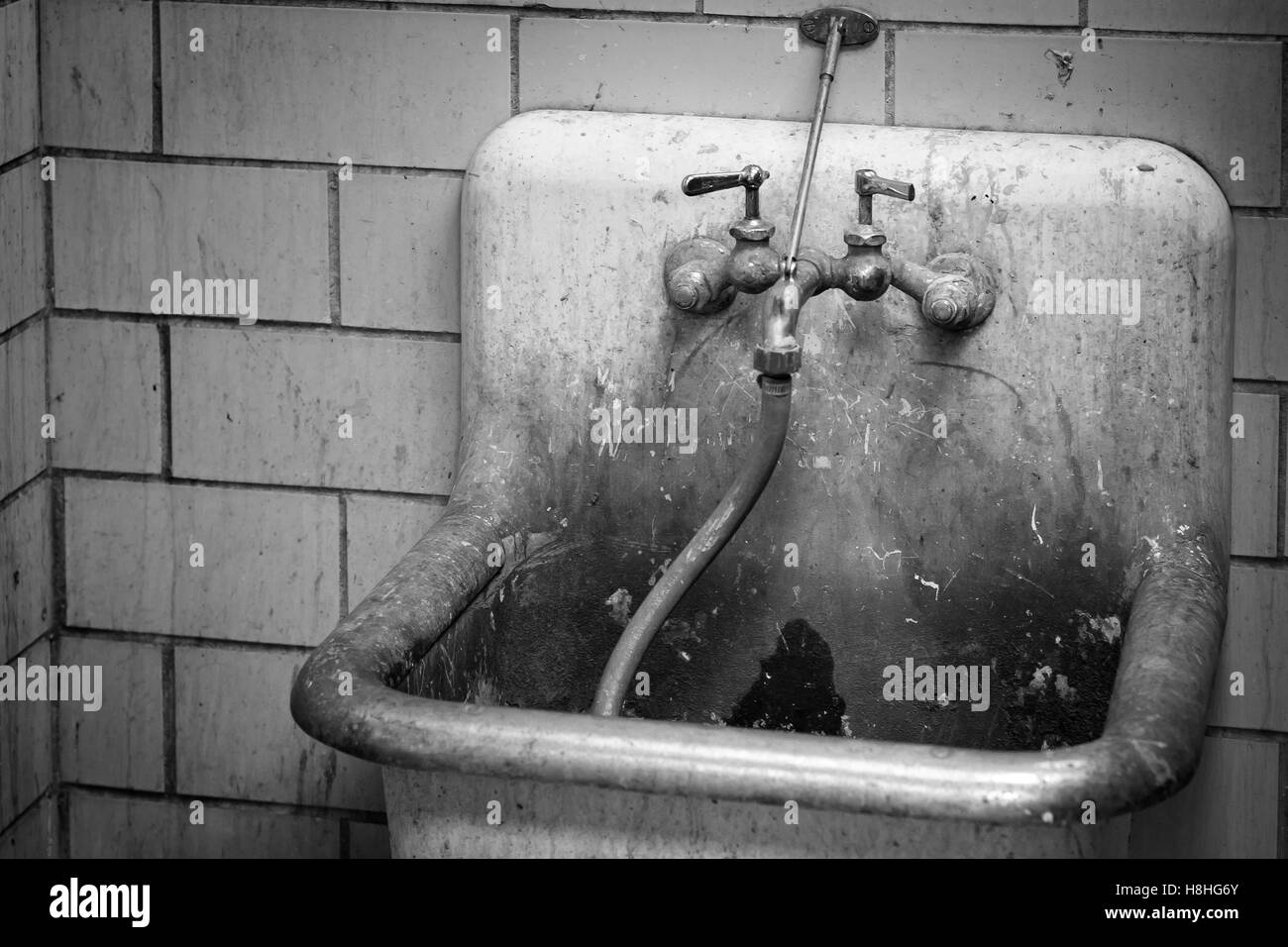 Sporco bidello dissipatore di utilità Foto Stock