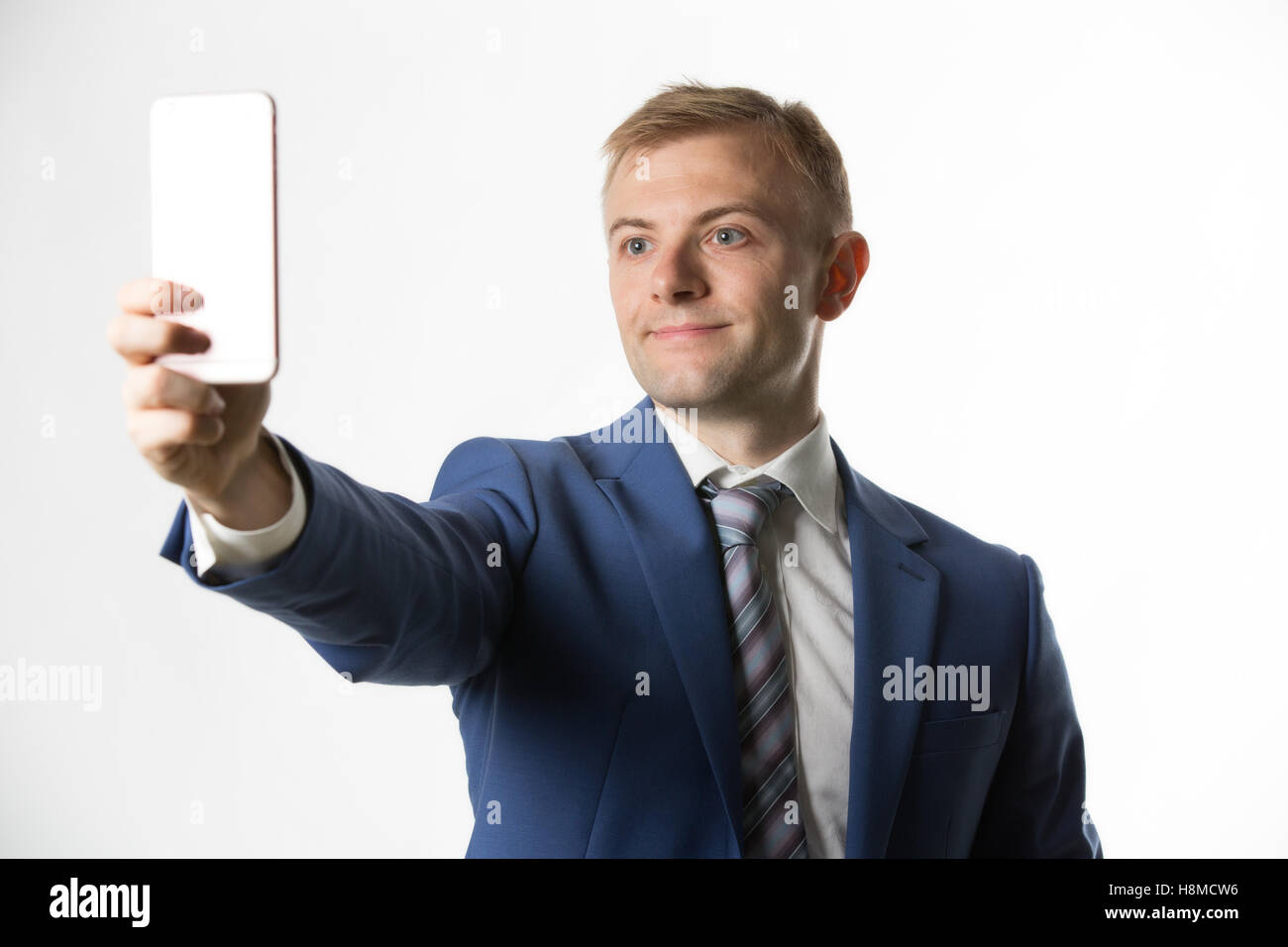 Imprenditore tenendo un selfie Foto Stock