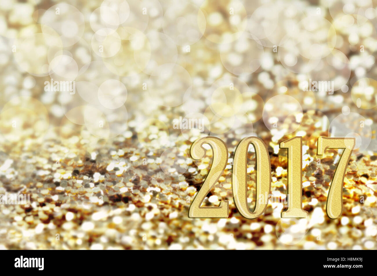 2017 golden cifre scritte su luci luminose sullo sfondo Foto Stock