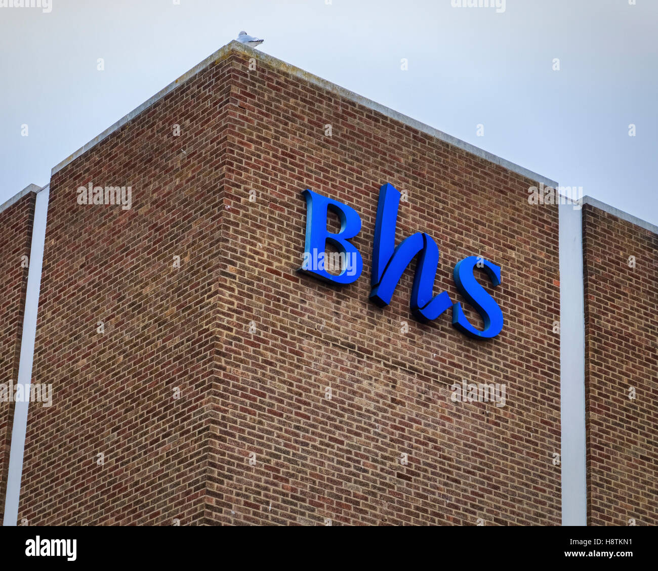 BHS British Home logo Negozi onbrick parete del negozio chiuso, Southend on Sea, Essex Foto Stock