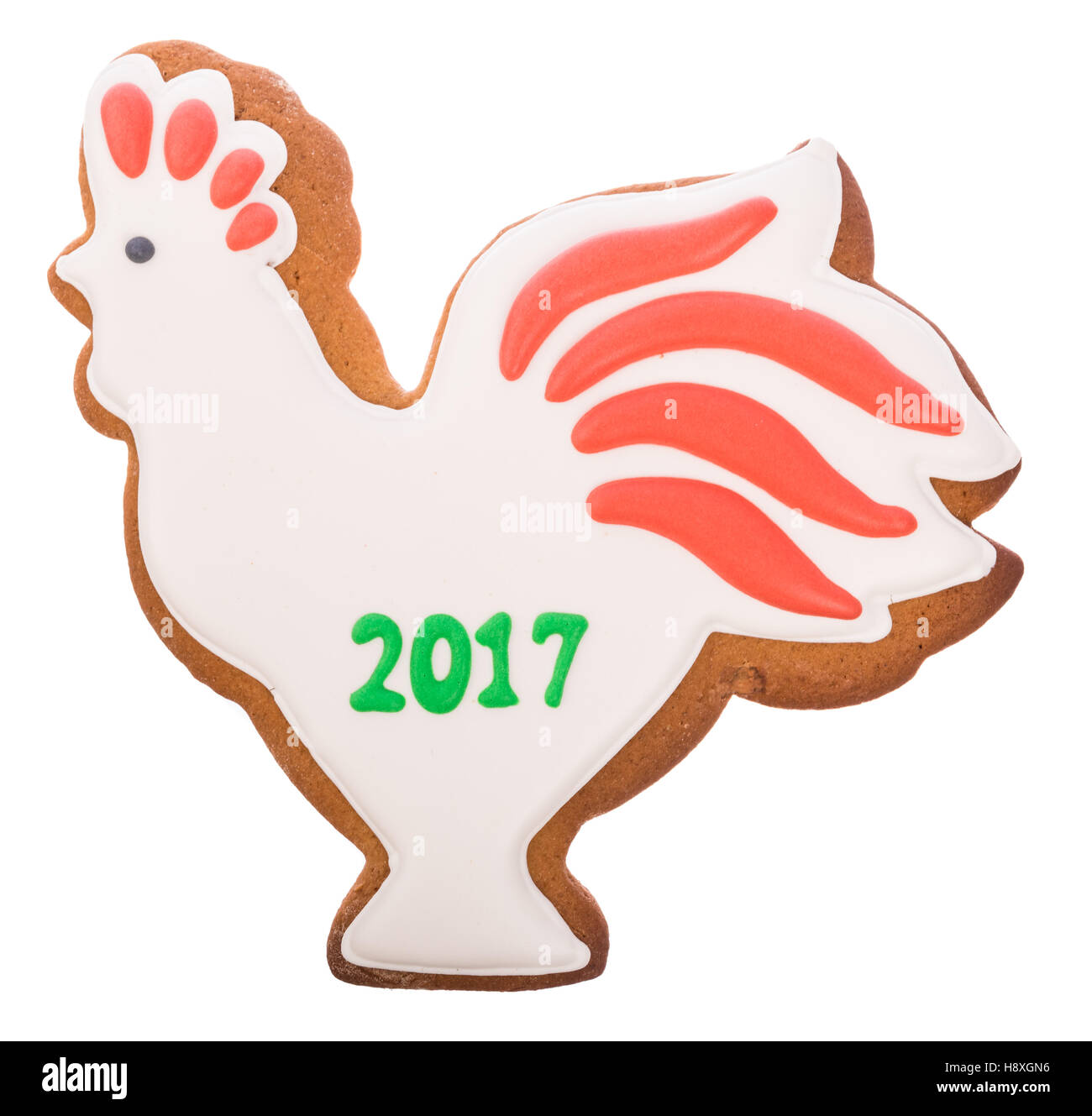 Bello e delizioso zenzero natale gingerbread rooster - un simbolo del nuovo anno isolato su sfondo bianco Foto Stock