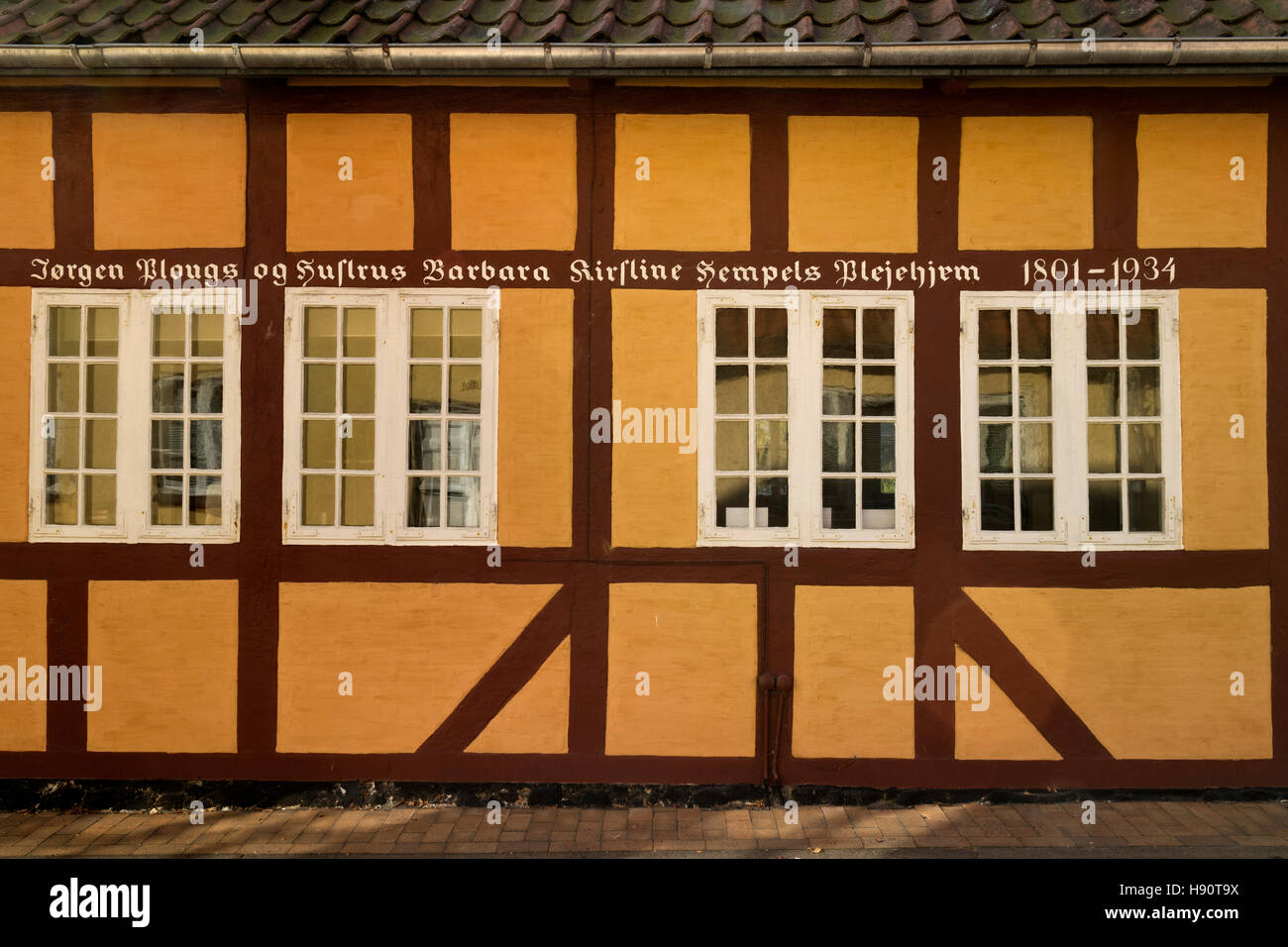 Tradizionale casa costruita con un testo nella città di Faaborg, Danimarca Foto Stock