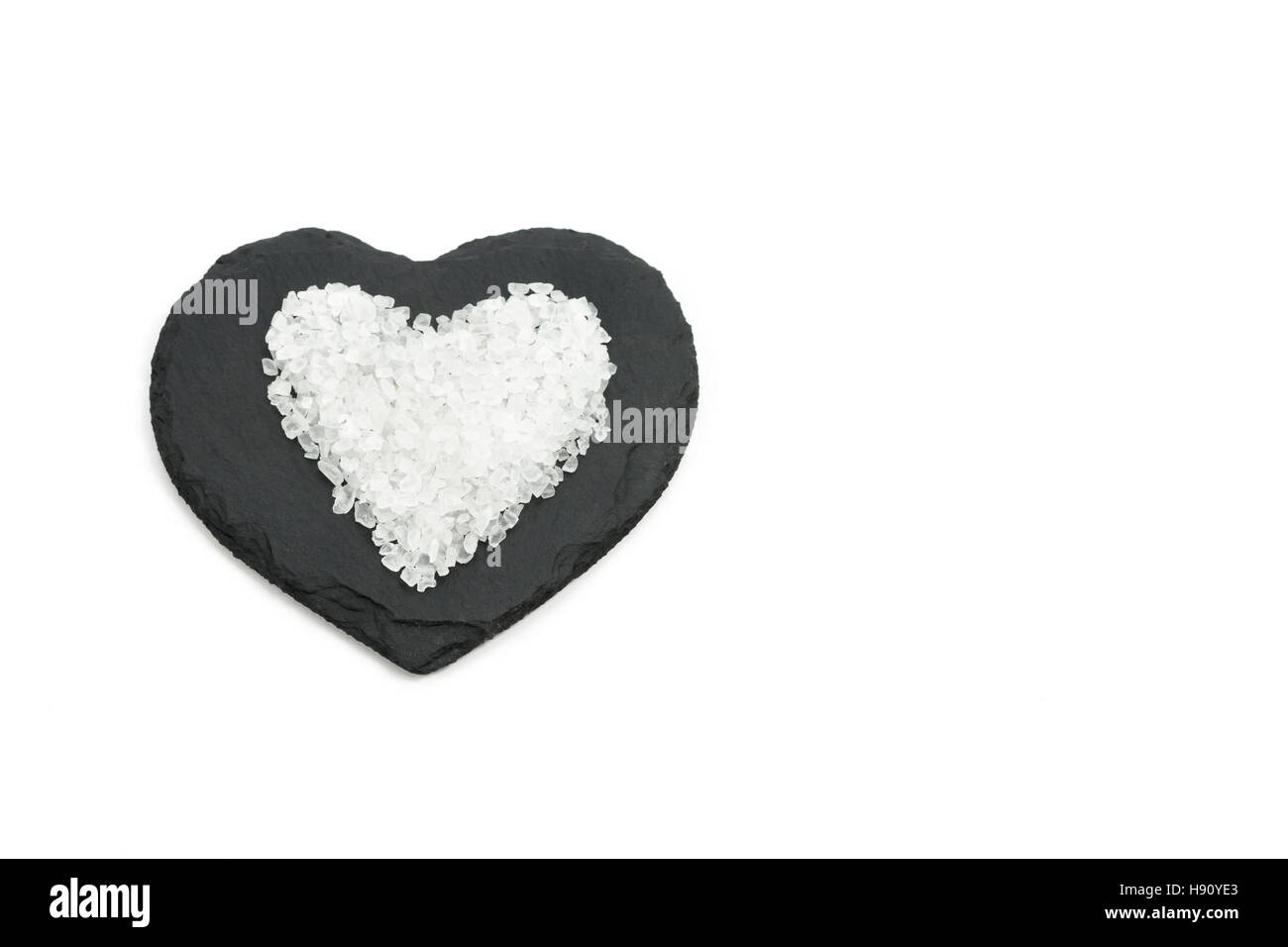 Salgemma cuore su nero a forma di cuore ardesia Foto Stock