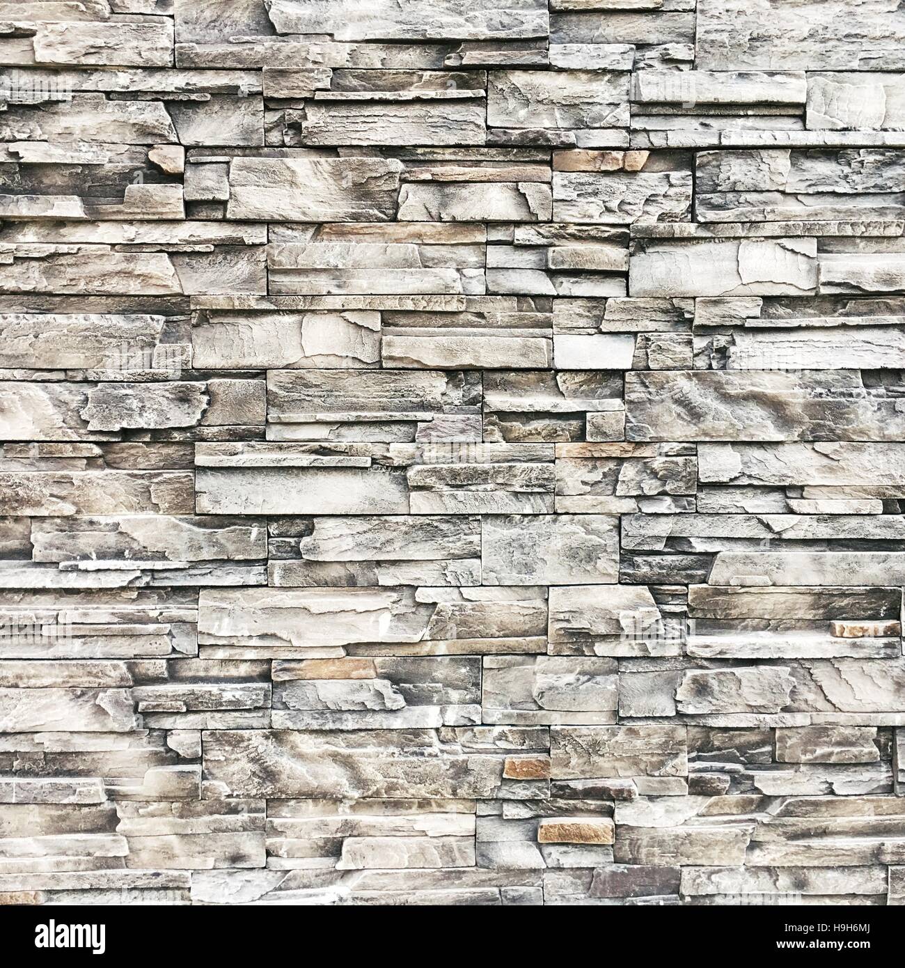 Muro di pietra, sfondo, texture, rock, mattoni, pattern, home, superficie, moderno, architettura, grigio ardesia, interno, vecchio, sfondo, sfondo, granito, costruzione, esterna, ruvida, blocco, cemento bianco, grigio, testurizzati, nero, struttura astratta, natura Foto Stock
