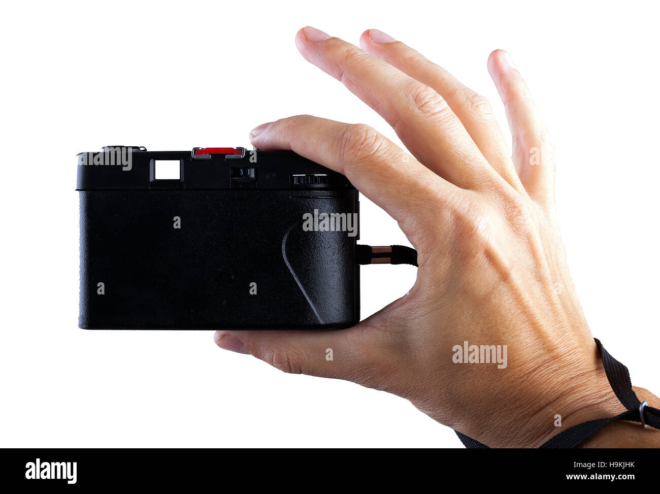 Concetto di viaggio. Mano rendendo la foto con la vecchia macchina fotografica Foto Stock