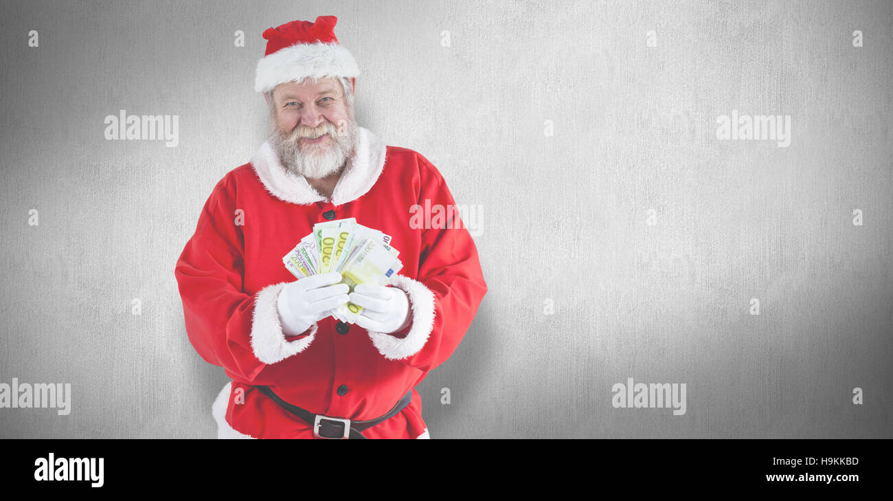 Immagine composita di Babbo Natale mostra moneta note Foto Stock