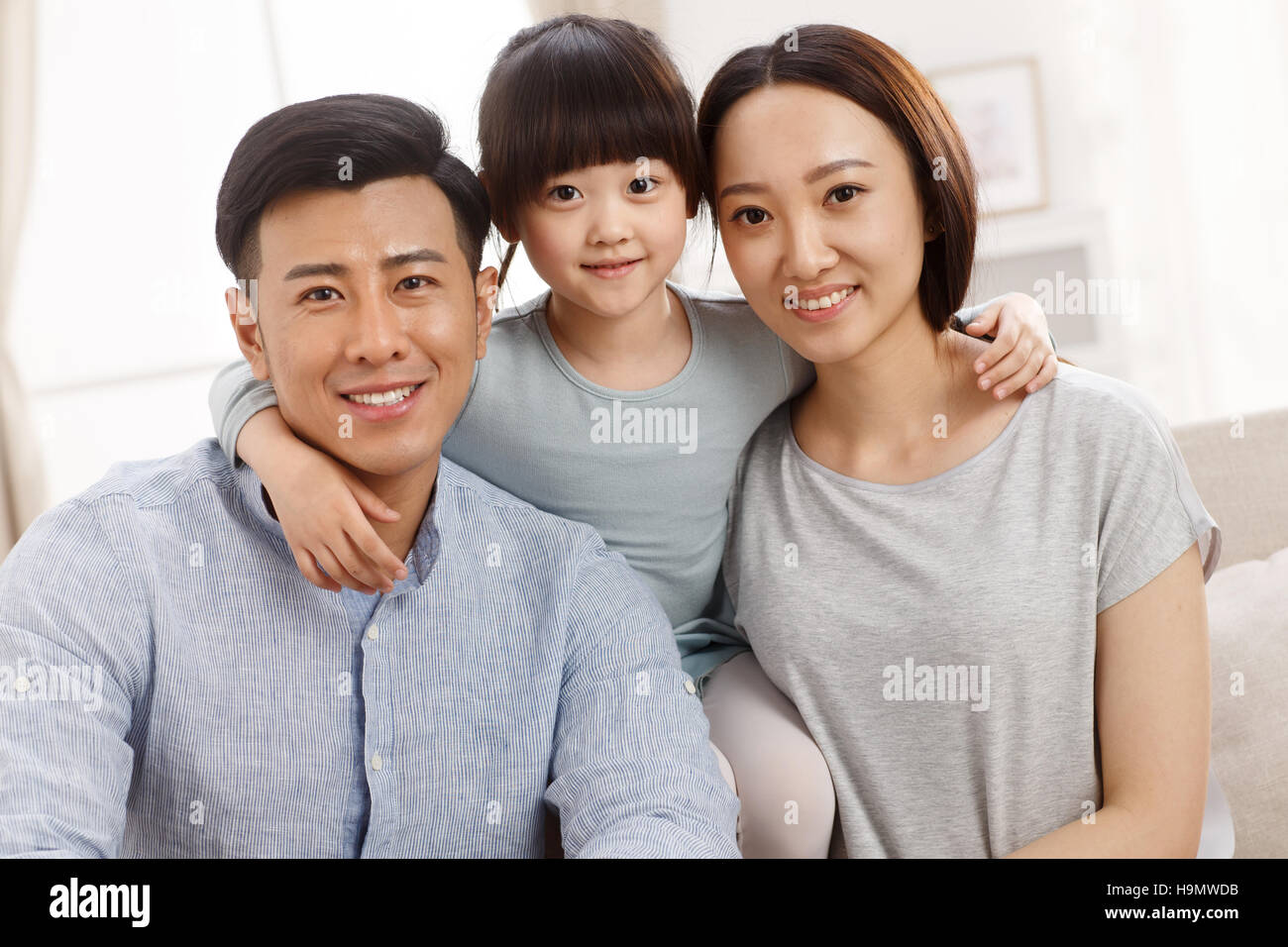 Una famiglia felice di tre foto Foto Stock