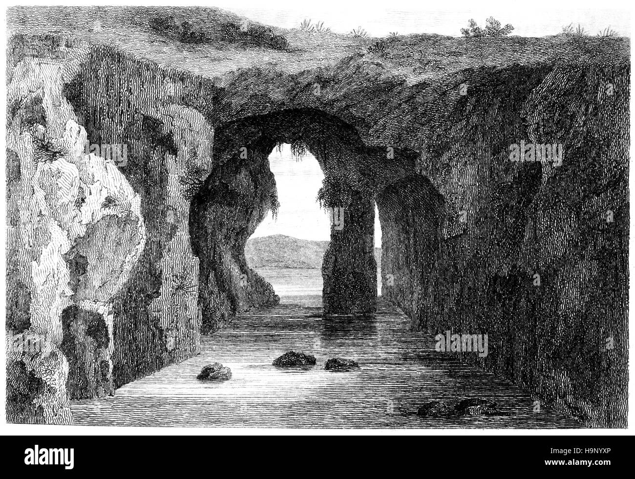 Una incisione di Catherine's Cave, Tenby, Pembrokeshire scansionati ad alta risoluzione da un libro stampato in 1812. Foto Stock