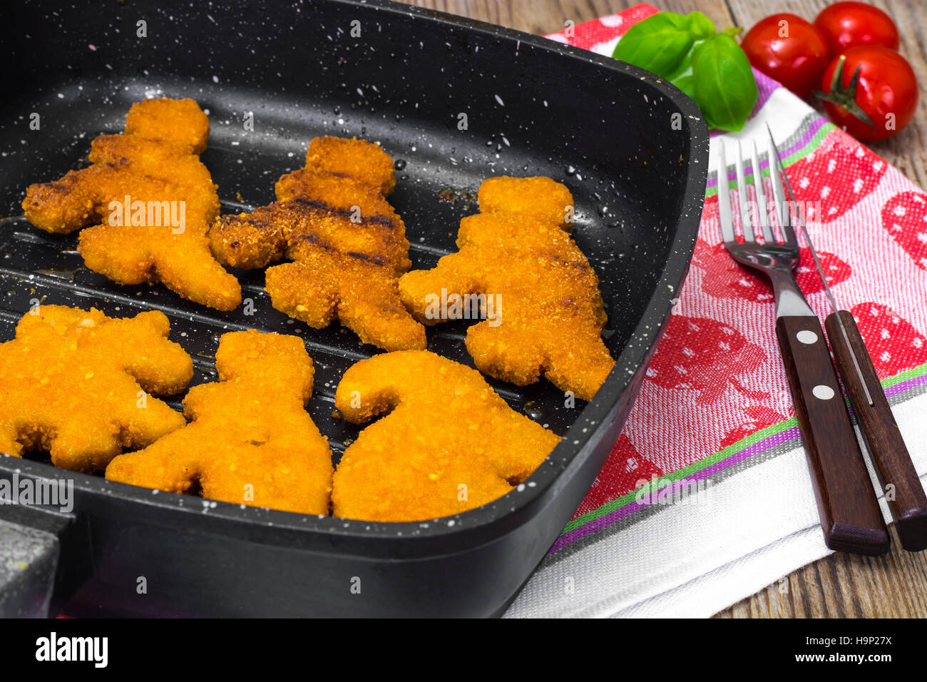 Pepite di pesce per i bambini i dinosauri Foto Stock