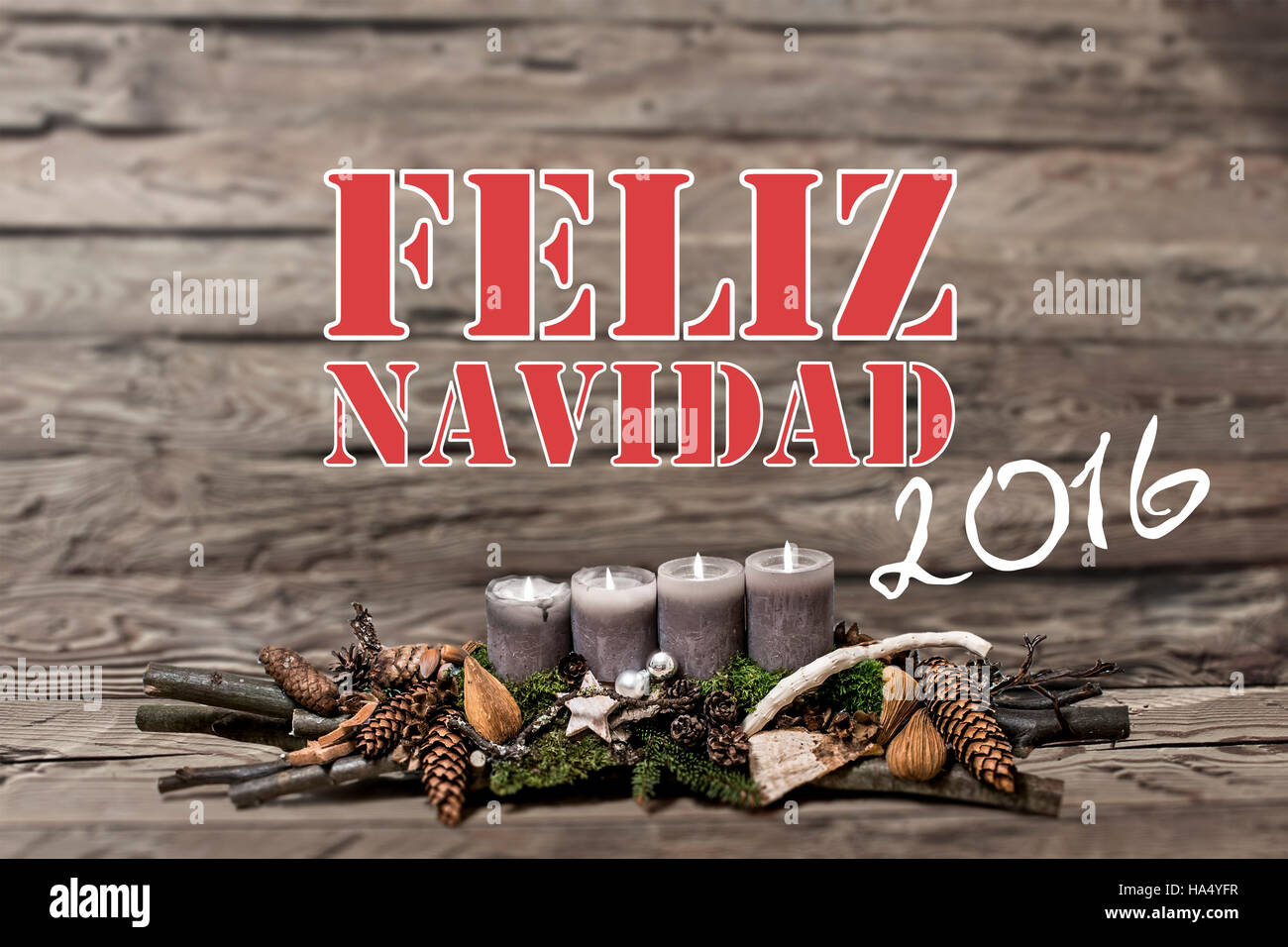 Buon Natale decorazione 2016 con la masterizzazione di candela grigio sfondo sfocato messaggio di testo di origine ispanica Foto Stock