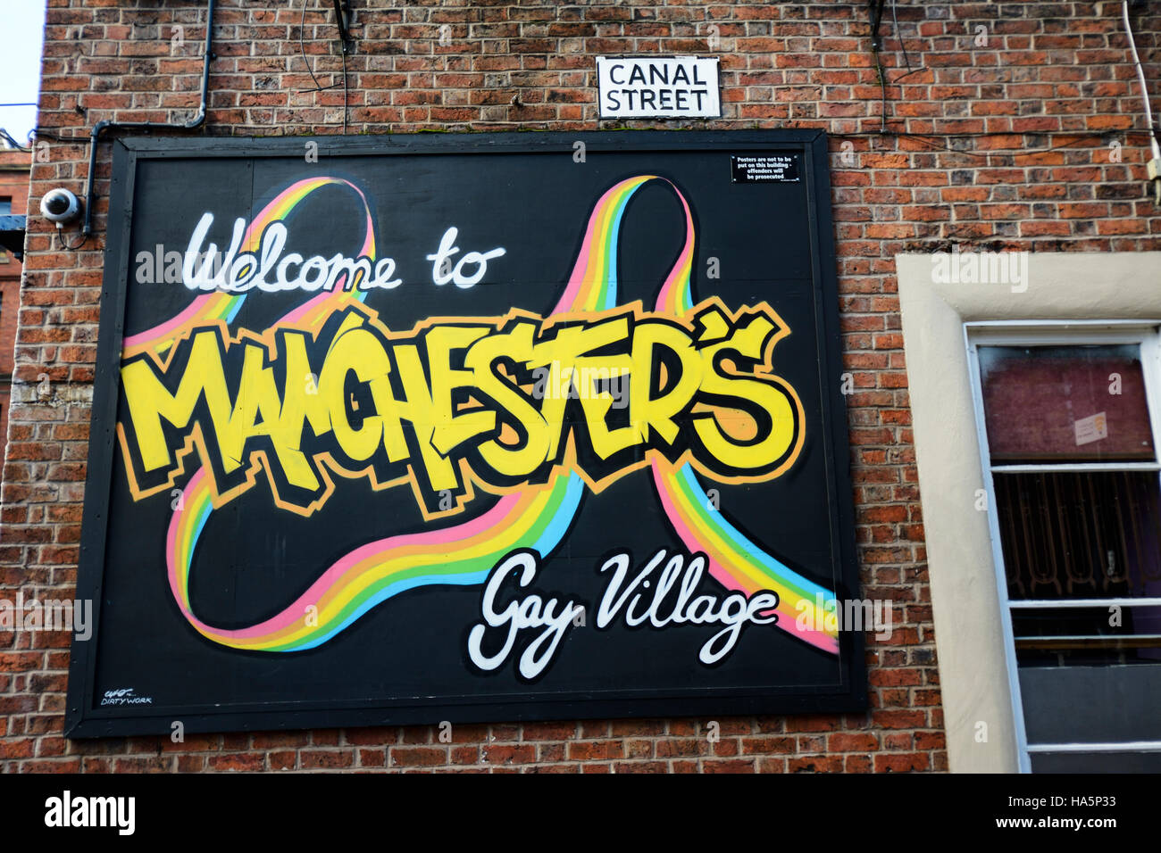 Benvenuti a Manchester il villaggio gay sign in Canal Street, Manchester. Foto Stock