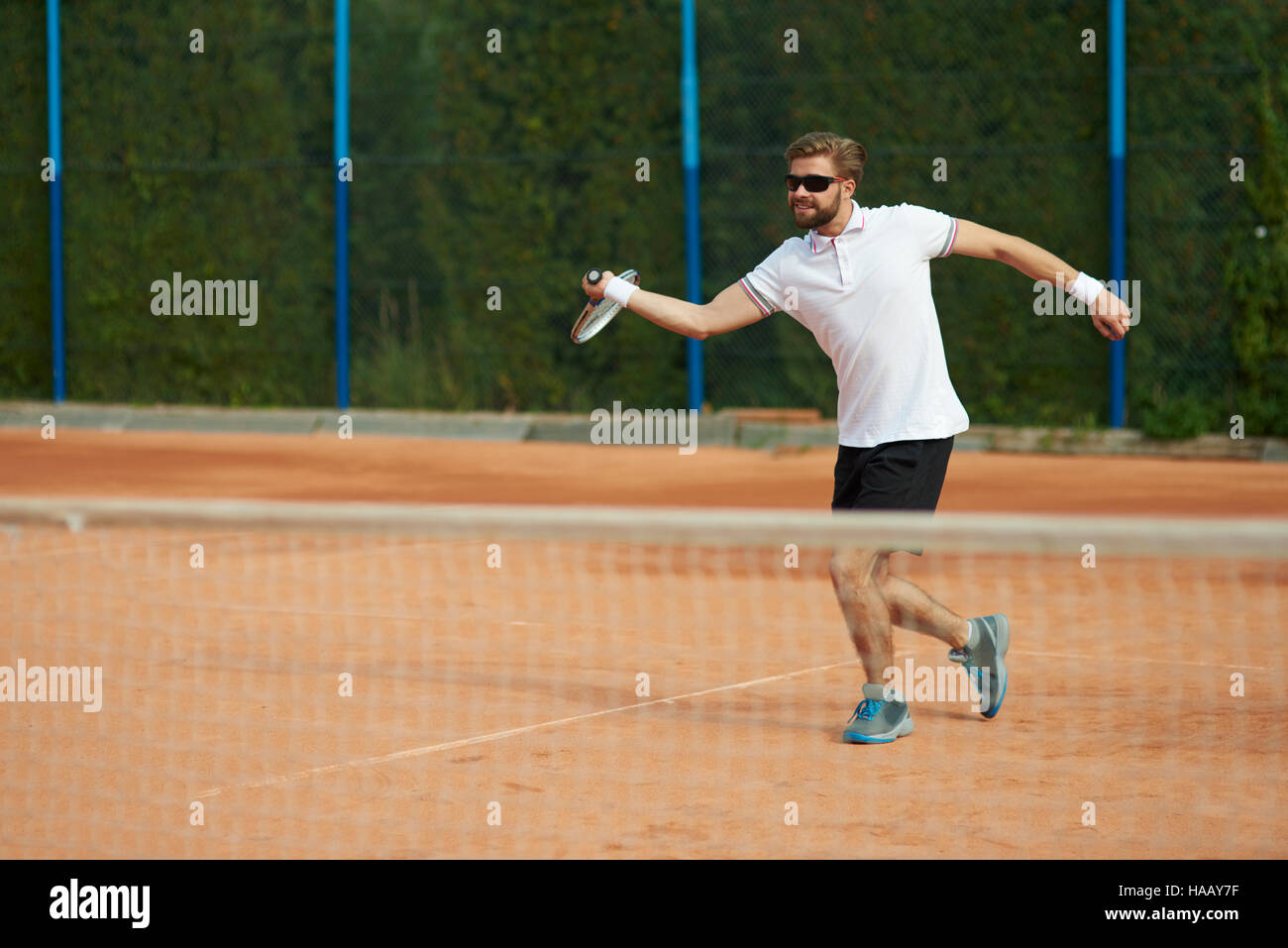 Giocatore di Tennis in movimento Foto Stock