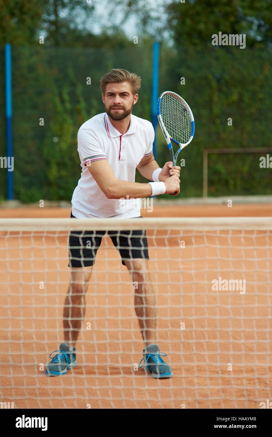 Il giocatore di tennis è pronto per rispondere Foto Stock