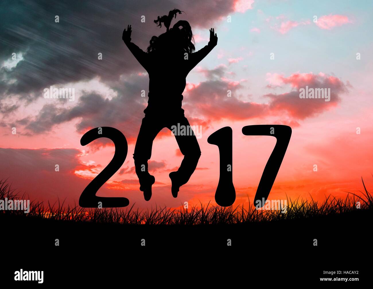 Silhouette di una persona di salto formando 2017 Anno nuovo segno Foto Stock